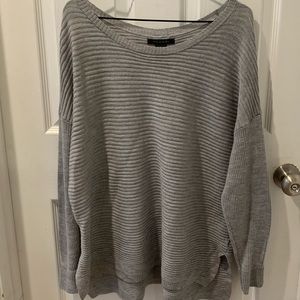 Grey sweater with buttons down the back